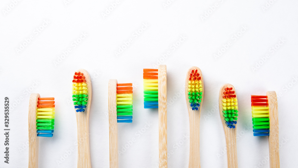 Bamboo toothbrushes with copy space on a white background