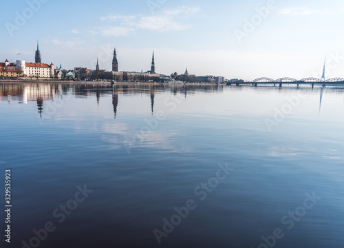 Cityscape of Riga Latvia with Reflections on a Quiet Still River