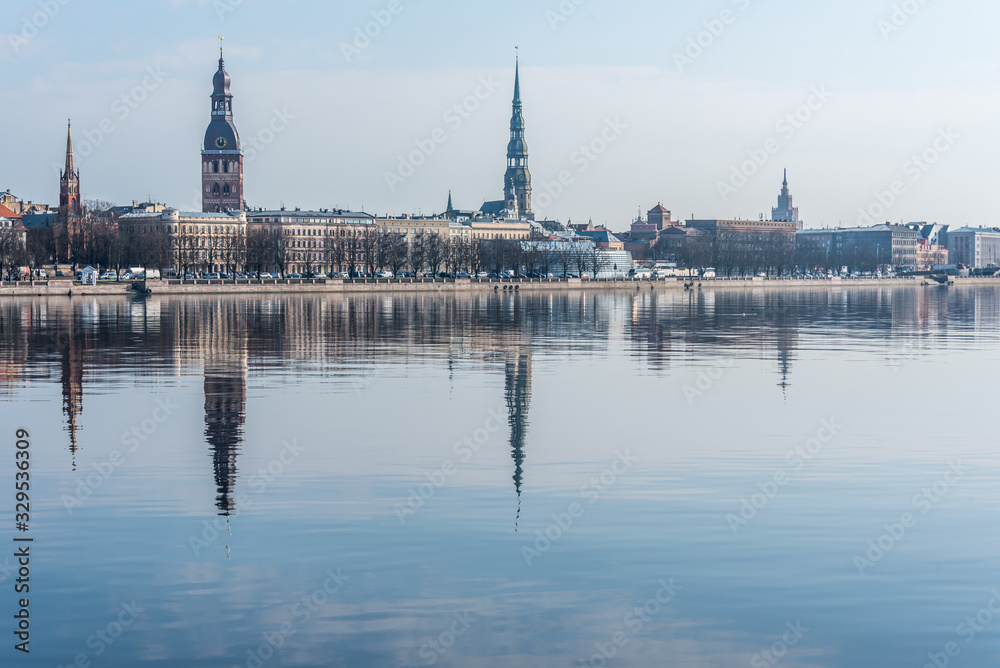 Cityscape of Riga Latvia with Reflections on a Quiet Still River
