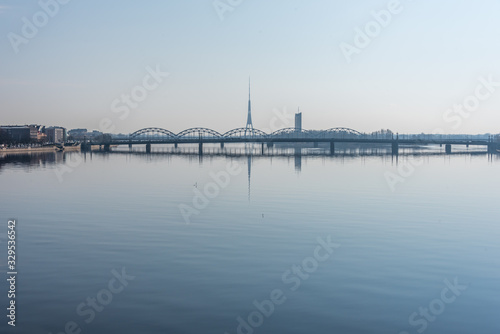 Cityscape of Riga Latvia with Reflections on a Quiet Still River © JonShore