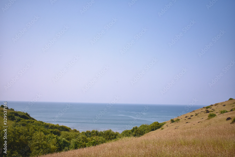 beautiful view of the ocean from the side of the clip of a hill