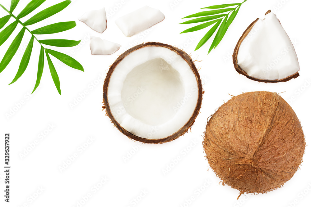 half coconut with green leaves isolated on white background top view half coconut with green leaves isolated on white background top view