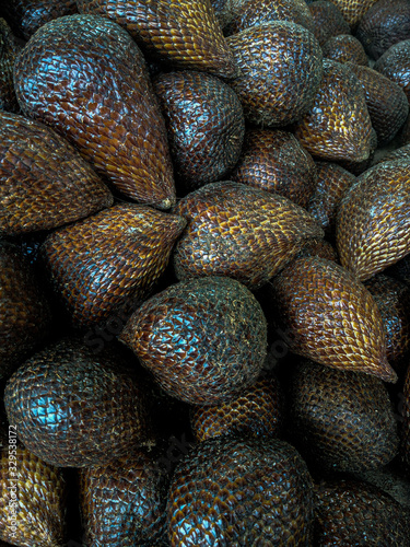 Salak fruit bunch. Salak or snake fruit, while the scientific name is Salacca zalacca. This fruit is called snake fruit because the skin is similar to snake scales.