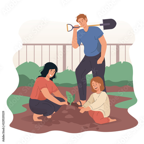 Happy family gardening together in backyard garden