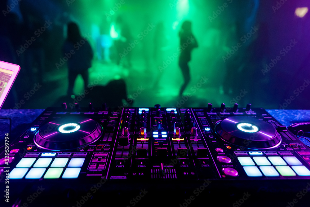 DJ mixer in the booth on the background of the dance floor Photos | Adobe  Stock