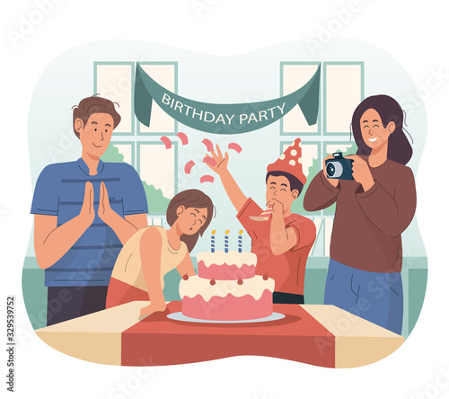 Happy family celebrating little girl's birthday at home