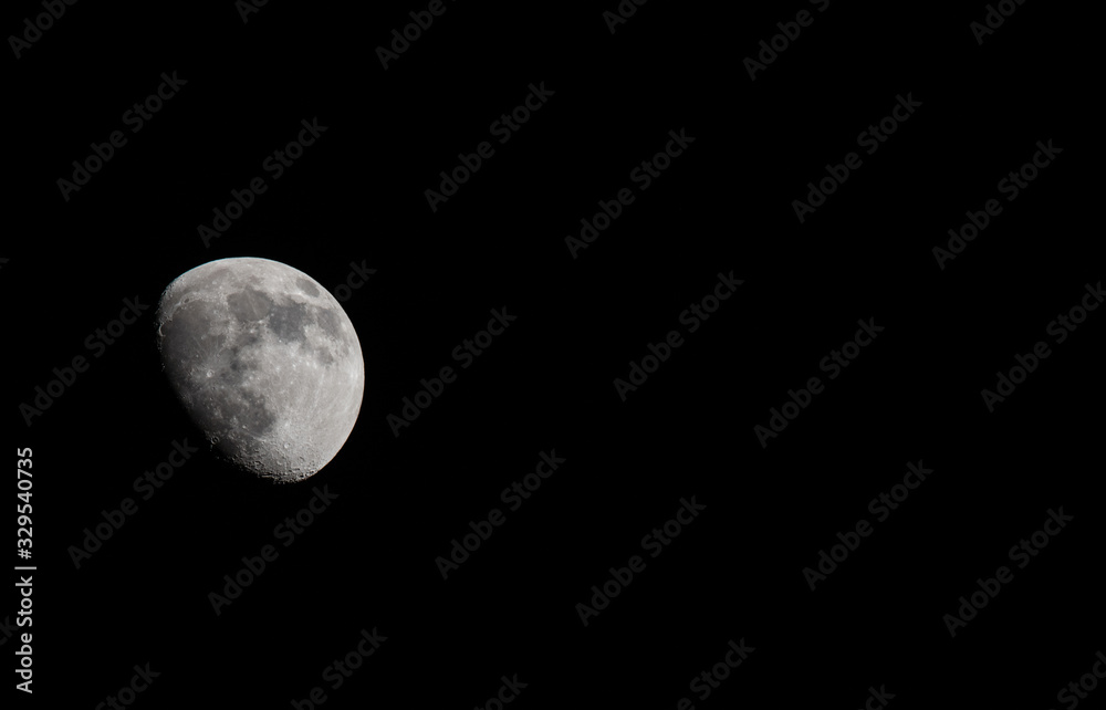 Closeup of a Three Quarter Moon in a Black Sky Closeup of a Three Quarter Moon in a Black Sky