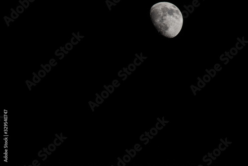 Closeup of a Three Quarter Moon in a Black Sky