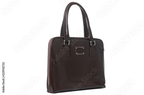 leather female brown bag on the handle sideways on a white background