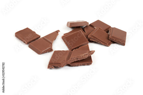 pieces of dark milk chocolate bar isolated on white background.