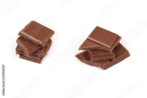 pieces of dark milk chocolate bar isolated on white background.