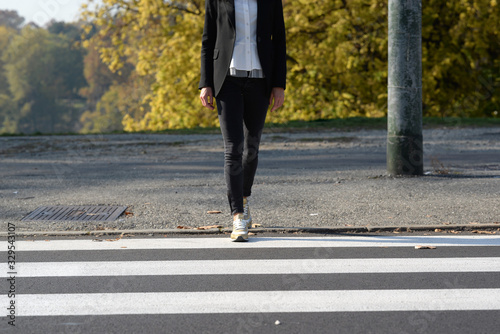 Wallpaper Mural Woman walks on the pedestrian crossing, front view Torontodigital.ca