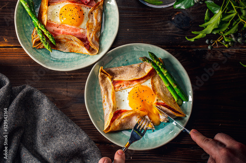 Fototapeta Naklejka Na Ścianę i Meble -  Galette,French food buckwheat pancake,with egg in plate. Healthy food concept image.