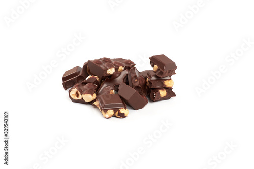 Chocolate pieces with nuts isolated on white background