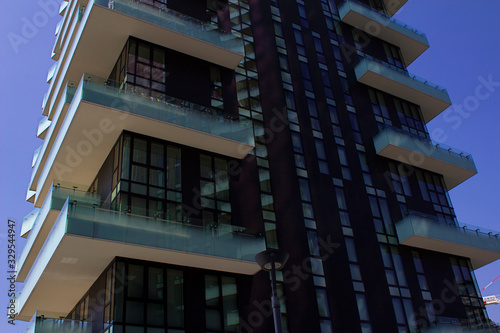 Skyscrapers and modern shops in glass and steel and new innovative materials as contemporary architecture in Milan business district, Italy photo