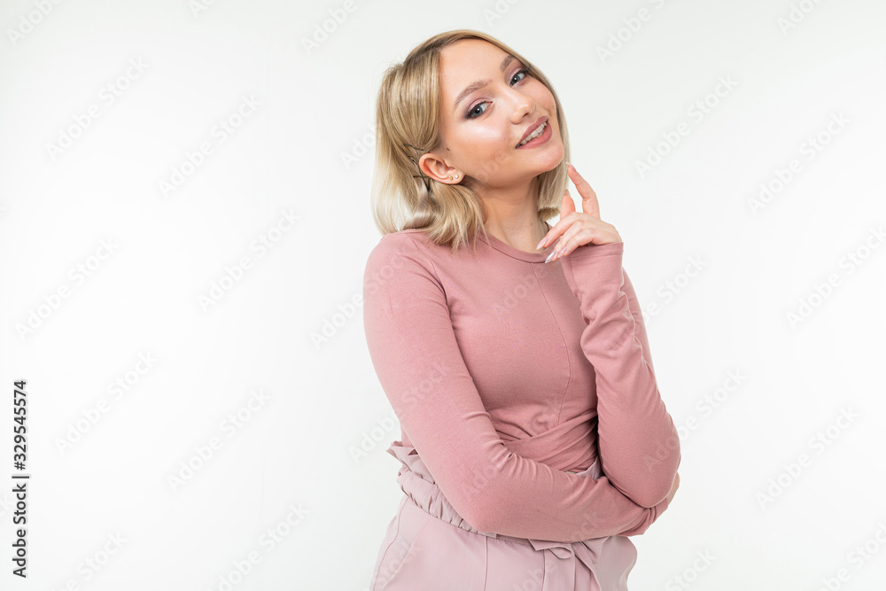 portrait of a stylish short-haired girl smiling on a white studio background with copy space portrait of a stylish short-haired girl smiling on a white studio background with copy space