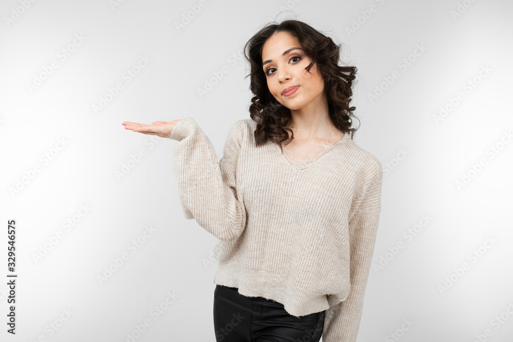 young woman with black hair with holding hands on a white background young woman with black hair with holding hands on a white background