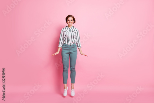 Full length photo of cheerful positive girl have spring free time jump enjoy wear formalwear style outfit isolated over pastel color background