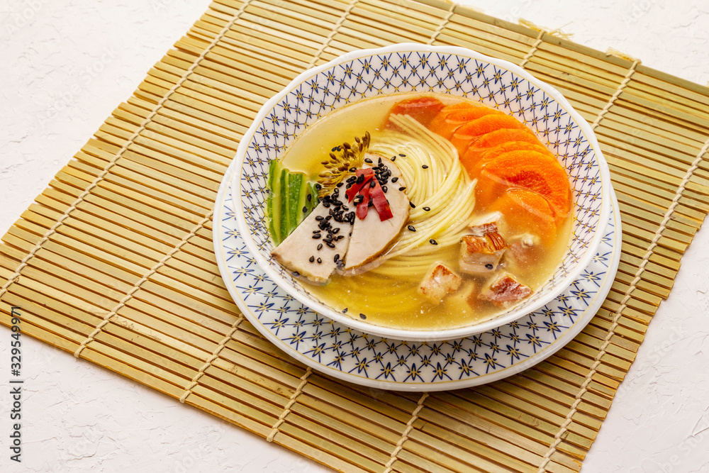 Korean noodle soup with smoked chicken and vegetables. Spicy dish for healthy meal Korean noodle soup with smoked chicken and vegetables. Spicy dish for healthy meal
