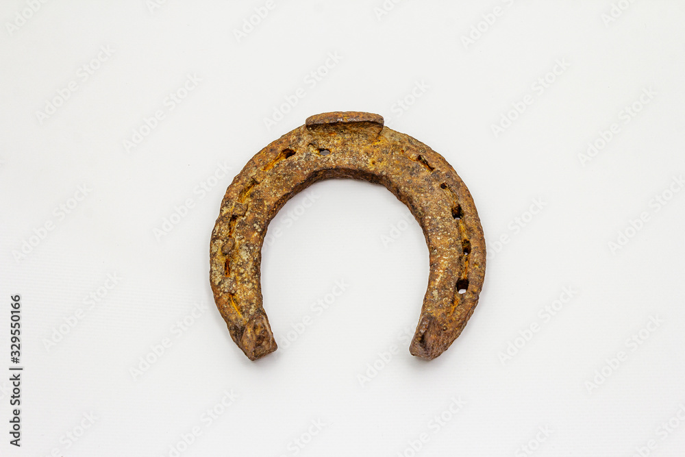 Cast iron metal horse horseshoe isolated on white background Cast iron metal horse horseshoe isolated on white background