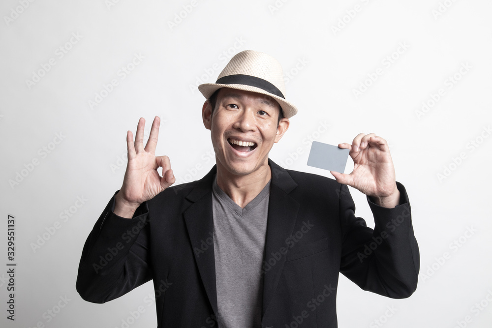 Adult Asian man show OK with a blank card. Adult Asian man show OK with a blank card.