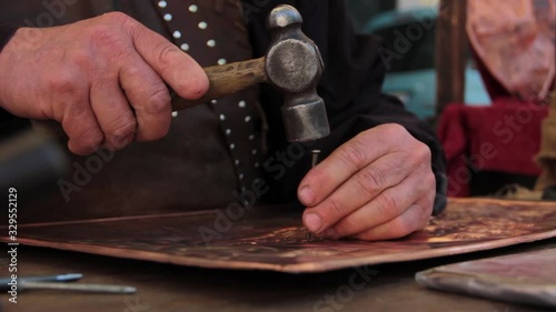 ancient works. metal engraving. hands work on copper