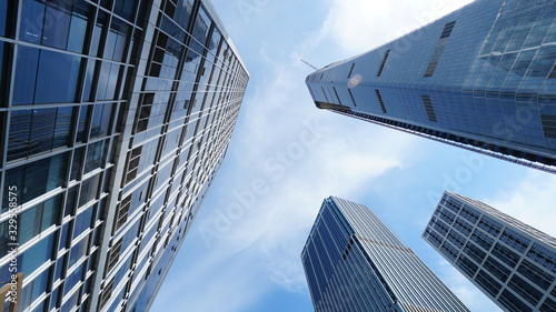 A low-angle shot of the mordern skyscrapers in the downtown and city buildings