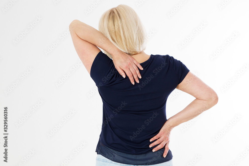 Middle-aged blonde woman with back pain isolated over white background, middle age female pain back view copy space, Female with suffering from back pain and neck pain Middle-aged blonde woman with back pain isolated over white background, middle age female pain back view copy space, Female with suffering from back pain and neck pain