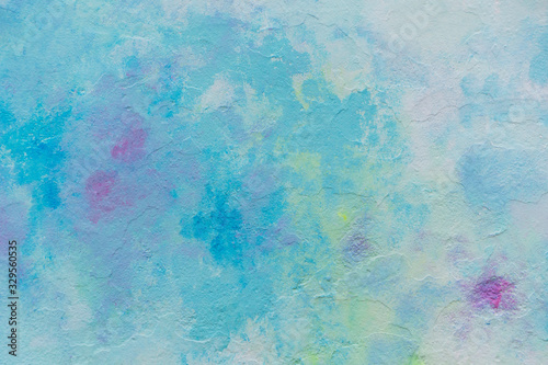 Abstract blue pink yellow and white painted wall texture background outdoors