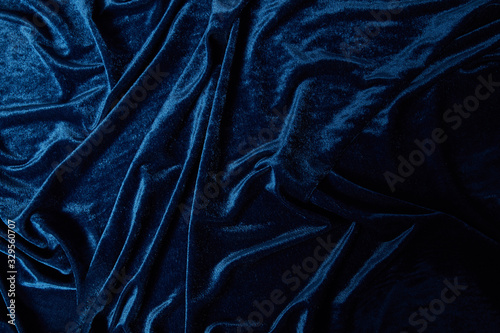 close up view of blue soft and crumpled velour textured cloth photo