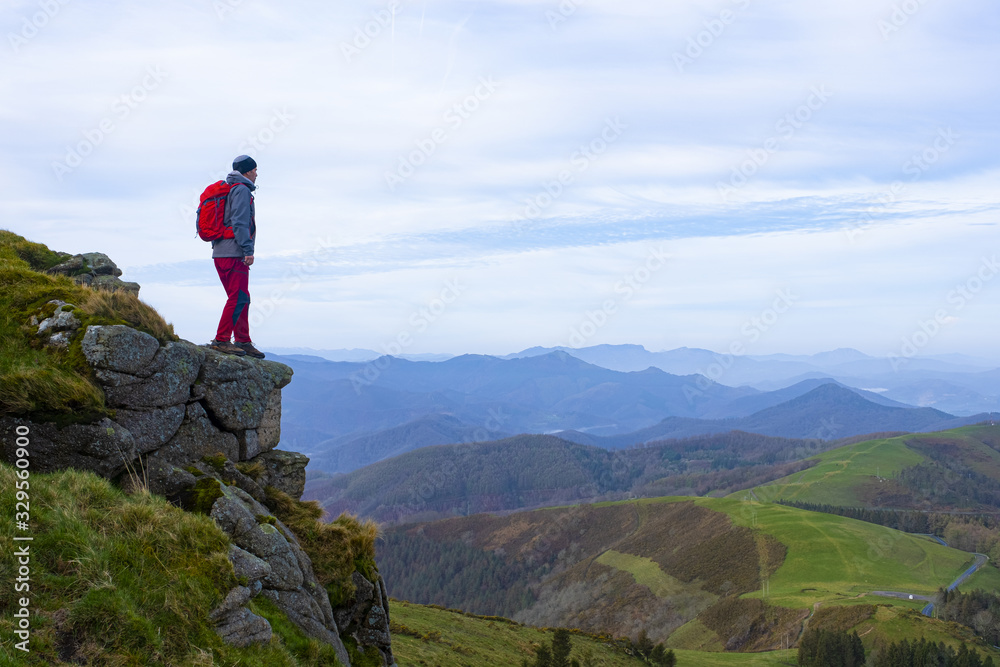 Hiker dressed in red in the natural park of Aiako Harriak, Euskadi