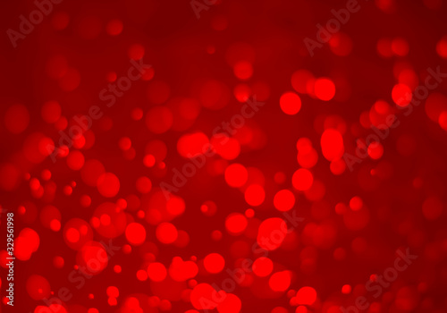Red glitter vintage lights background. White bokeh on red background.