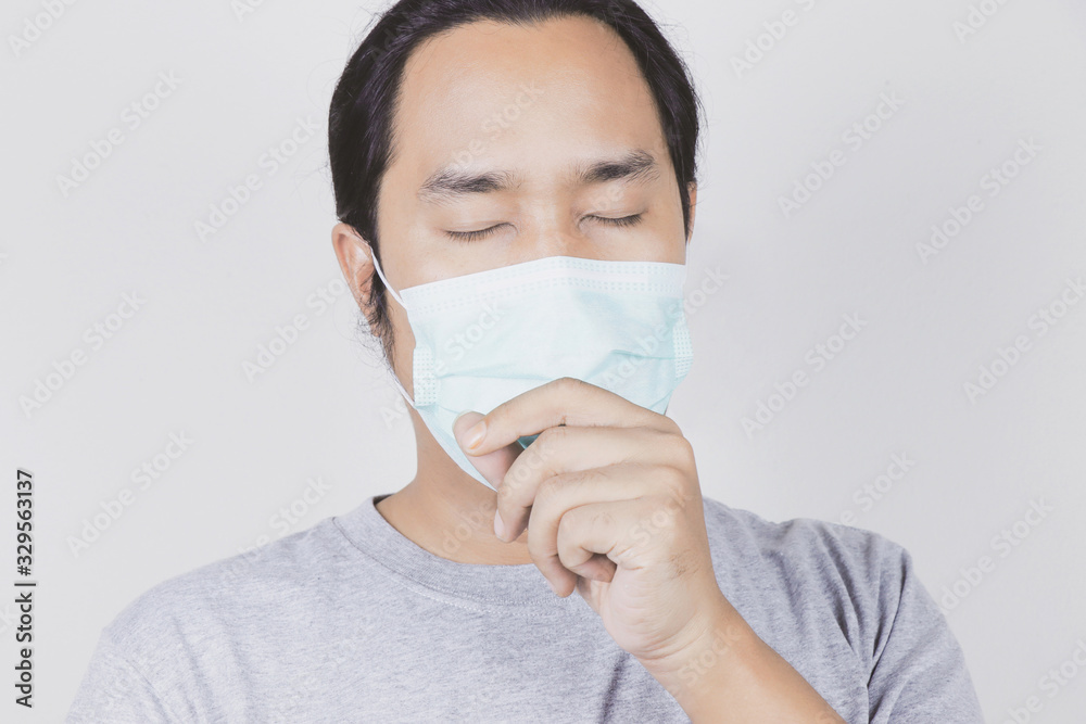 men wear masks to protect against the covid-19 virus, sneezing a