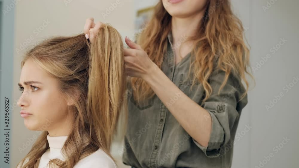 A hairdresser working with beautiful woman in at a beauty salon A hairdresser working with beautiful woman in at a beauty salon