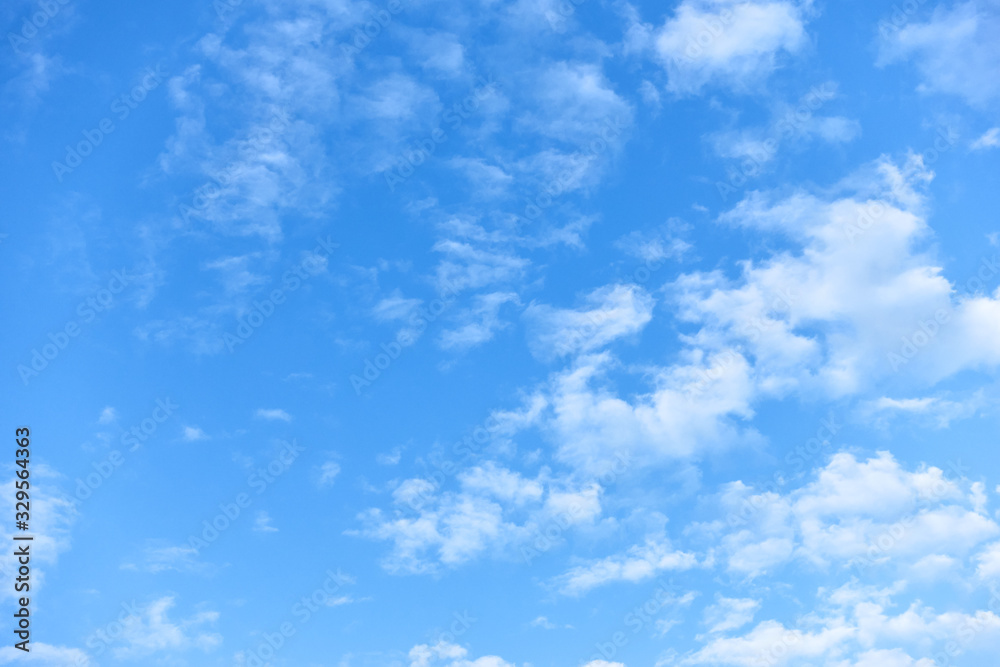 Blue sky with small white fleecy clouds Blue sky with small white fleecy clouds