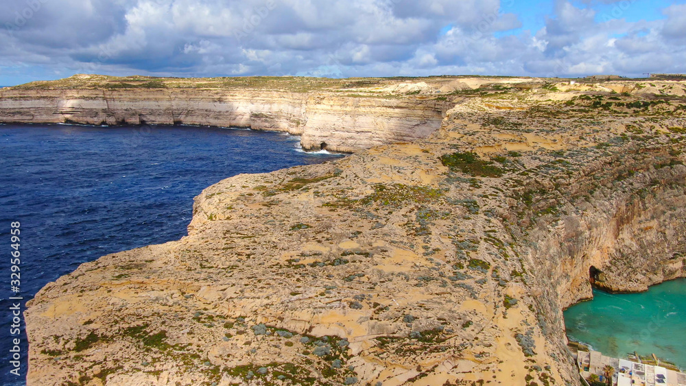Flight over Dwerja Bay at the coast of Gozo Malta - aerial photography
