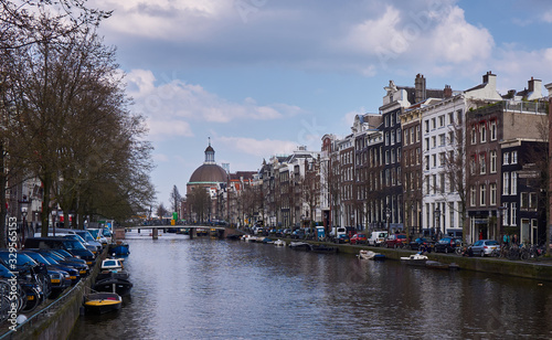 Amsterdam Canal Views of the canal with clouds in the sky Interesting buildings