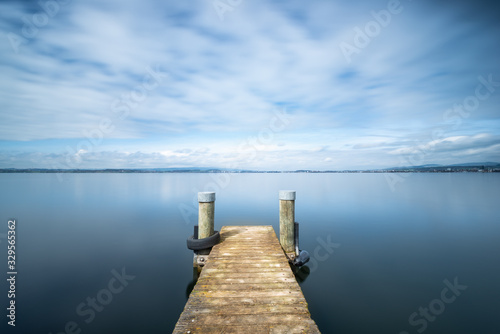 Long exposure landscape. Pier on the lake.