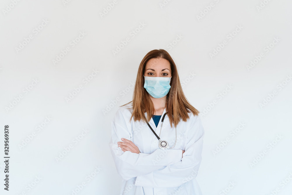 portrait of doctor woman wearing protective mask and gloves indoors. Corona virus concept