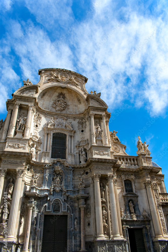 The beautiful cathedral at the city of Murcia, Spain. The facade of this medieval monument.  The building is elaborately decorated in the plateresque style, although the original structure is gothic.