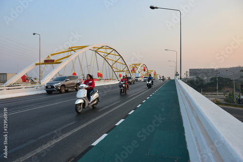 Nakhon sawan cityThailand December 30 2019 unidentified person driving on the Dechatiwong Bridge in the Chinese festival. photo