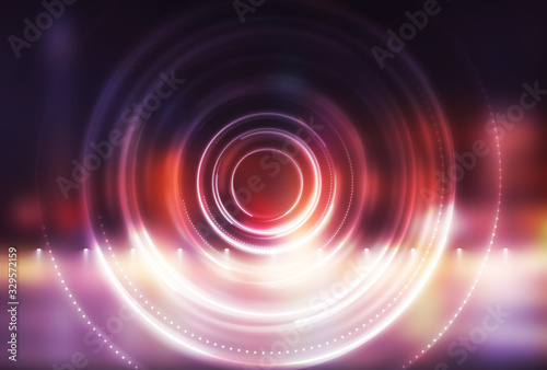 Dark abstract futuristic background. The geometric shape of the cyber circle in the middle of the scene. Neon colored rays of light on a dark background.
