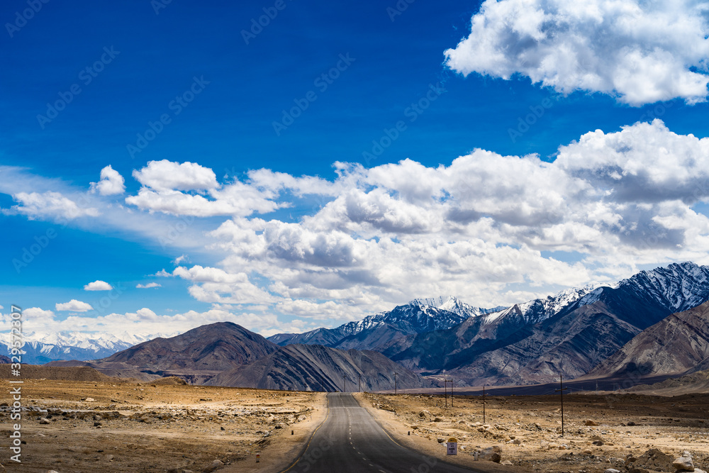 Landscape view during a road trip with snow mountains on the background in Ladakh, Jammu and Kashmir, North India Landscape view during a road trip with snow mountains on the background in Ladakh, Jammu and Kashmir, North India