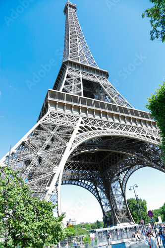 Eiffel Tower, symbol of Paris, in a beautiful summer day with blue sky