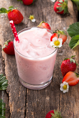 Fresh milk, strawberry on wooden table, assorted protein cocktail with fresh fruits. Natural background.