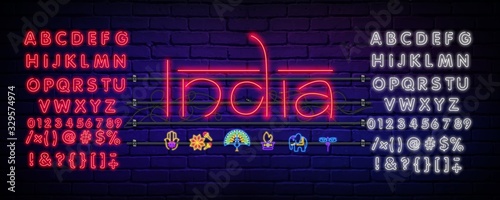 Neon composition of the title India . Vector illustration of glowing neon text and icons. Bright digital signage for banners, leaflets on a dark background.