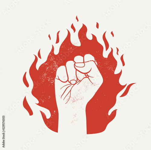Fototapeta Raised up fist on red fire flame silhouette