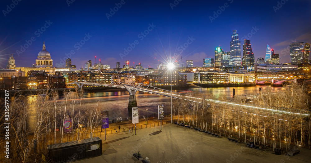 Millennium Bridge London with St. Paul's cathedral at night