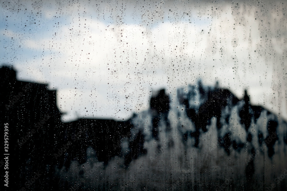 raindrops in a window glass, stormy  abstract background