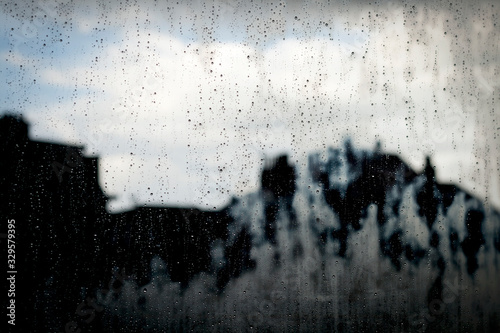 raindrops in a window glass, stormy abstract background